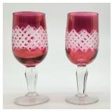 Pair fancy cut to clear cranberry cordials