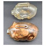small glass piggy banks one full of pennies