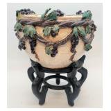 Viny porcelain planter on a wooden stand