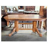 Oak finish dining table w two leaves