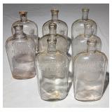 Antique glass quart flasks