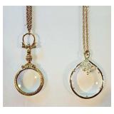 Two fancy magnifying glass necklaces