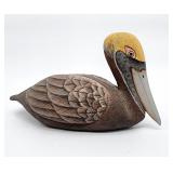 Brown pelican wood composition decoy signed
