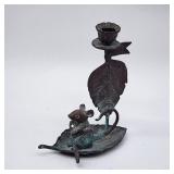 Bronzy mouse on leaf boat