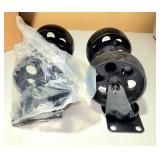 4 unused cast iron swivel casters