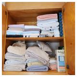 bathroom cabinet lot w towels & new soap