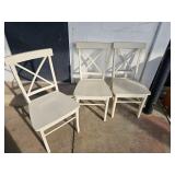 3 white wooden chairs