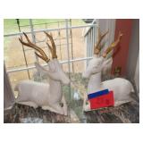 white deer figurines with gold-painted antlers