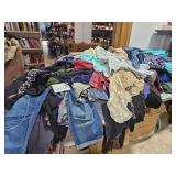 large pile of clothes plus pillows, linens, etc.