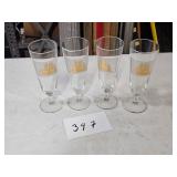 5 glasses with ship
