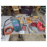 tools, gas can, welder helmet, drop light, etc.