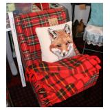 Plaid chair with fox pillow