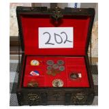 wooden box holds a collection of vintage tokens