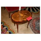 Oval side table with floral design
