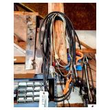PAIR OF MOWER WHEELS-6 USED MOWER BLADES- EXTENSION CORD PLASTIC PIECES-2 CORDS WITH SNAPS-(SHOP)