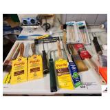 TUB OF PAINT SUPPLIES ROLLERS - NEW BRUSHES - PAINTERS TAPE - CRAFT BRUSHES - PAINTING BRUSHES - TRIM BRUSHES - NEW WALL ROLLERS - CONCRET AND GROUT/TILE TOOLS - KNEE PADS (UPSTAIRS)