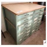 (2) 8-DRAWER BOLT CABINETS 2 SECTIONS W/FORMICA TOPS - INCLUDED EMBEMLEM FOR IT - ASSORTMENT OF WELDING RODS - THREADED BOLTS - VARIOUS LENGTHS OF BOLTS, VARIOUS SIZES - SMALL U BOLTS - PULLEY WHEELS 