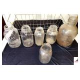 COLLECTION OF FRUIT JARS ATLAS MASON HALF GALLON - DREY PERFECT MASON GALLON - SPEE STYLE QUART WITH VAIL - CARROT, TOMATO, CORN, LETTUCE JAR - GALLON PRIMITIVE JUG - VAIL HANDLES, VAIL IS MISSING - T