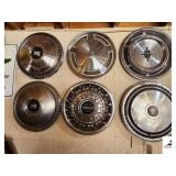 (6) HUB CAPS (WALL SHOP)