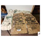 (4) SEED BAGS (2) WILL LADINO CLOVER CLOTH BAGS - RIM IS TORN ON ONE BAG - (2) VINTAGE HENDERSON CHESTER FARMERS CO-OP WHOLE SHELLED CORN PAPER BAGS - BAGS ARE USED - (UPSTAIRS)