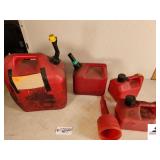 6 GALLON TANK OF HERBICIDE MIX - 2 GALLON GAS JUG - (2) 1 GALLON GAS JUG - FUNNEL - (SHED)