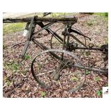 HORSE DRAWN WALKING CULTIVATOR 4 SCRATCHERS ON BACK - NO TONGUE - HANDLES DETERIORATED - TWO METAL WHEELS - (OUTSIDE)