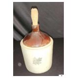 WESTERN STONEWARE JUG - CORN COB STOPPER - BROWN AND WHITE - BLUE LEAF WITH NAME ON FRONT - (KITCHEN)