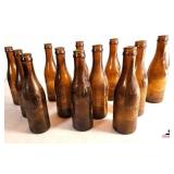 (12) AMBER COCA-COLA COMMEMORATIVE BOTTLES JACKSON, TN - 75TH ANNIVERSARY 1905-1980 - COCA-COLA WALL  BOTTLE OPENER - (GARAGE)
