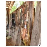 EXTENSION CORDS - HEAVY DUTY APPOX. 50+ FT. YELLOW CORD- ORANGE CORC TRIPLE PLUG - (IMP SHED)