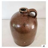 STONEWARE JUG W/ HANDLE - BEEHIVE STYLE - CHIPS ON RIM - PECK IN SIDE - LIGHT CRACK ON BOTTOM - (KITCHEN)