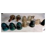 (11) GLASS INSULATORS HEMMINGWAY GREEN & CLEAR #42 - CSA CLEAR - WHITE ALL-TATUM CO - (2) WITH WOOD CONNECTION, 1 CHIPPED - WIRE BASKET & PORCELAIN CONNECTOR - (GARAGE)