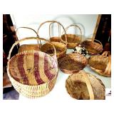 COLLECTION OF WOVEN BASKETS (10) 7 SHORT PIECES MISSING IN LARGE BASKET - EASTER, FLOWER, BREAD BASKETS - SINGLE AND DOUBLE HANDLE - ONE WITH NO HANDLE - (UPSTAIRS)