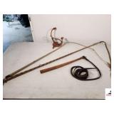 COLLECTION OF STOCKMAN WHIPS LEATHER AND FABRICK, TURN BULLWHIP HANDLE WITH LEATHER LEAD REIGN ATTACHED - RAWHIDE WHIP THAT HAS BROKEN IN TWO - A DECREATIVE ROPE AND MINITURE LEATHER SADDLE - (GARAGE)