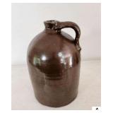 STONEWARE JUG #3 W/ HANDLE - BROWN - SMALL CHIP ON RIM - 9" BASE -13 1/2" TALL - (KITCHEN)