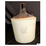 WESTERN STONEWARE JUG W/ HANDLE - BROWN AND WHITE - BLUE LEAF WITH NAME ON FRONT - FEW LIGHT CHIPS ON RIM - (KITCHEN)