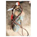 SMALL ACETYLENE SET W/ SMALL TANK & HOSES GAUGE IS DAMAGED AND LOOSE - (SHOP)