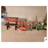 COCA-COLA BOTTLES MEMORBILLIA  AND BENCH 6 COKE CLASSIC 8OZ IN PAPER CARTON - 3 EXTRA COKE BOTTLES - 32OZ BOTTLE - WORN RC BOTTLE - SPRITE BOTTLE - MELLO YELLO BOTTLE - (GARAGE)