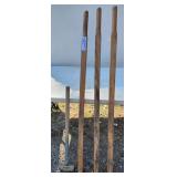 (4) POST HOLE DIGGER HANDLES (NEW) SLEDGE HAMMER (HANDLE TAPED) - (NE BLDG 5)