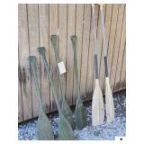 15 PADDLES-4 SHORT PLASTIC PADDLES- 2 ROWING PADDLES-ALUMINUM AND WOOD-SOME ARE CRACKED(OUTSIDE)