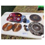 (4) CHEVY SPINNER HUBCAPS- SHOW SOME RUST (5) WINDOW SHADES -(4) SALVAGE FLUORESCENT LIGHTS-(2)TAIL LIGHTS- (1) CRACKED- FLYWHEEL- DISTRIBUTOR CAP- MISC ITEMS- (2) ROLLS OF EDGING