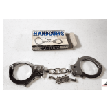 PAIR OF HANDCUFFS W/ 2 SETS OF KEYS
