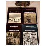 COLLECTION OF THE VIETNAN EXPERIENCE BOOKS RAISING THE STAKESAMERICA TAKES OVERPASSING THE TORCHSETTING THE STAGESTATUE OF NAVY SOLDIER STANDING ON A ROCK