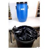 BLUE PLASTIC BARREL WITH LID- EMPTY- BLACK PLASTIC 32 GALLON GARBAGE CAN