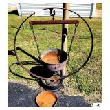 STEEL WAGONWHEEL RIM W/ HANGING IRON KETTLE #10 W/ LEGS, MOUNTED ON CAR RIM- OLD LARGE CAST IRON SKILLET- HANDLE BENT