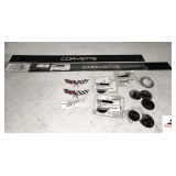 (2) CORVETTE PLATE SILLS- (2) DECORATIVE CAR ATTAHCMENTS- (3) PACKS OF 76-79 EMBLEM, CENTER CAP WITH ROSSED FLAGS