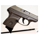 RUGER LCP 380 PISTOL SEMI-AUTO .380 CAL 2.75" BARREL - TAN/BROWN TWO TONE - W/ 1 MAG - HOGUE SLIDE ON RUBBER GRIP - BLACK FINISH W/ COPPER CHAMBER - SLIGHT BLUING WEAR ON CHAMBER SLIDE - EXCELLENT APP