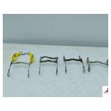 (4) HORSE BITS- (1) METAL BIT WITH YELLOW NYLON AND CHAIN NOSEBAND- (1) METAL BIT WITH CHAIN NOSEBAND- (2) CURVED BITS