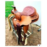 VINTAGE TEX TAN HEREFORD WESTERN SADDLE , HAND FLORAL TOOLED POMMEL, CANTLE, AND SKIRT, BILLET KEEPER, STITCHED LEATHER PADDED SEAT, DECORATIVE SILVER CONCHOS, WHITE LEATHER WRAPPED STIRRUPS, POMMEL H