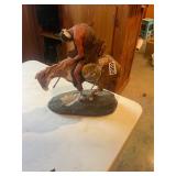 Indian on horseback statue figure