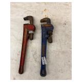 2- pipe wrenches. Red and blue